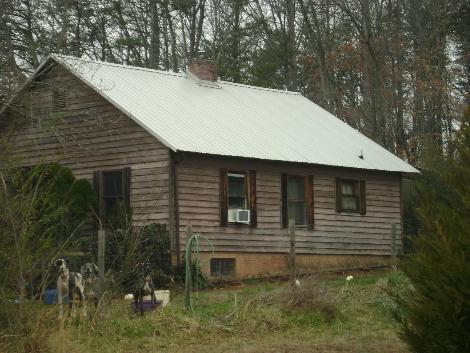 White metal roof on an old wood sided farmhouse, from a Metal Roof Installation job in Obernburg